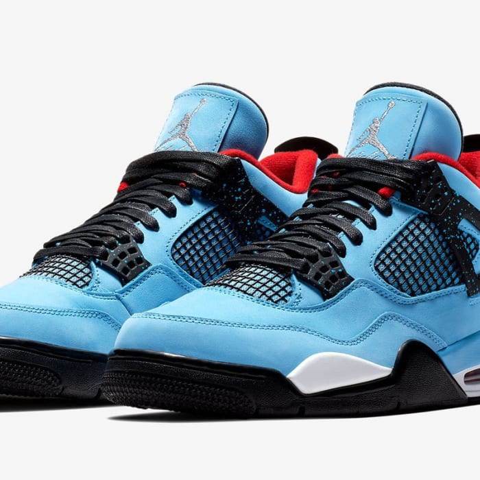 Blue and black Travis Scott x Air Jordan shoes.